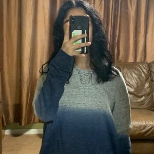 grey and blue sweatshirt